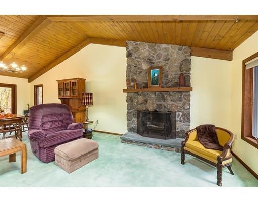 50 Deer Bay Road Ashby, MA 01431 - Photo 23 of 40 a living room with furniture and a fireplace