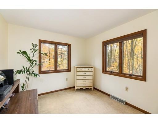 50 Deer Bay Road Ashby, MA 01431 - Photo 26 of 40 a view of an empty room with a window and wooden floor