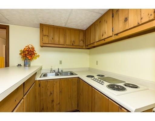 50 Deer Bay Road Ashby, MA 01431 - Photo 30 of 40 a kitchen with kitchen island a sink stove and cabinets