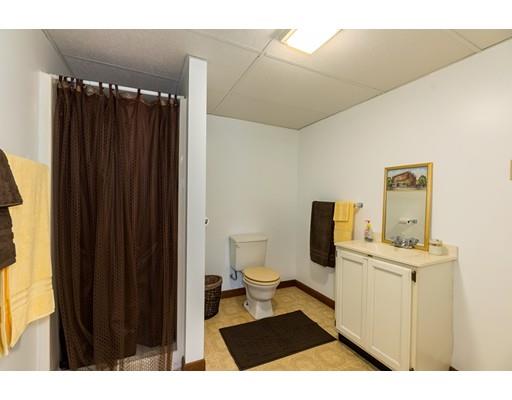 50 Deer Bay Road Ashby, MA 01431 - Photo 31 of 40 a bathroom with a sink toilet and shower