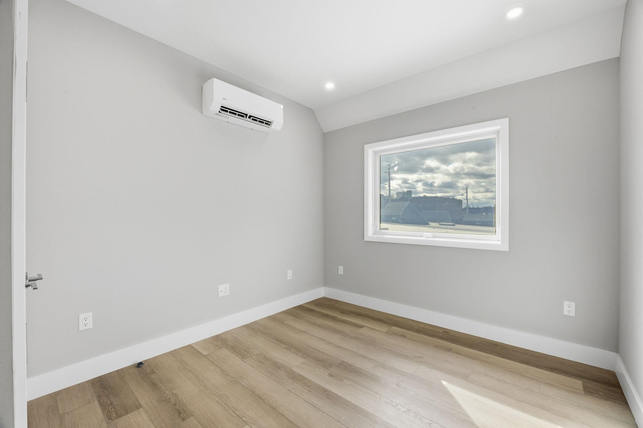 77 Van Reypen Street, Unit 4 Jersey City, NJ 07306 - Photo 11 of 23 a view of empty room with window