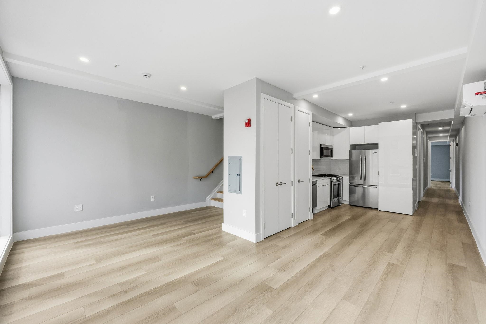 77 Van Reypen Street, Unit 4 Jersey City, NJ 07306 - Photo 14 of 23 a view of a livingroom with wooden floor