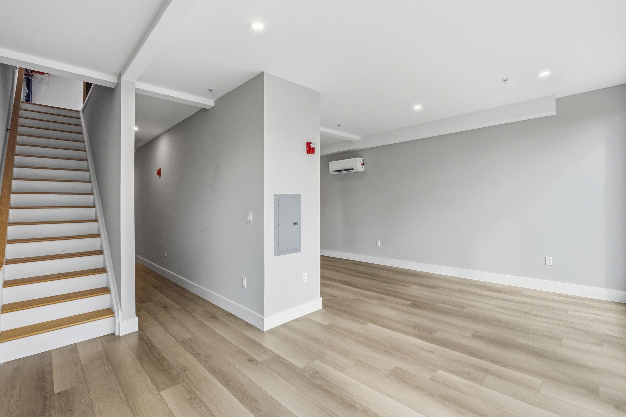 77 Van Reypen Street, Unit 4 Jersey City, NJ 07306 - Photo 15 of 23 wooden floor in an empty room with a window