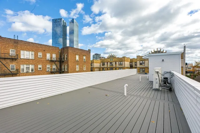 a view of a balcony with wooden floor