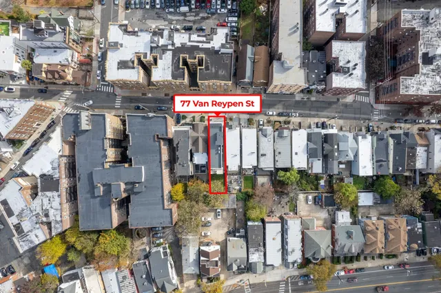 an aerial view of residential building with parking space