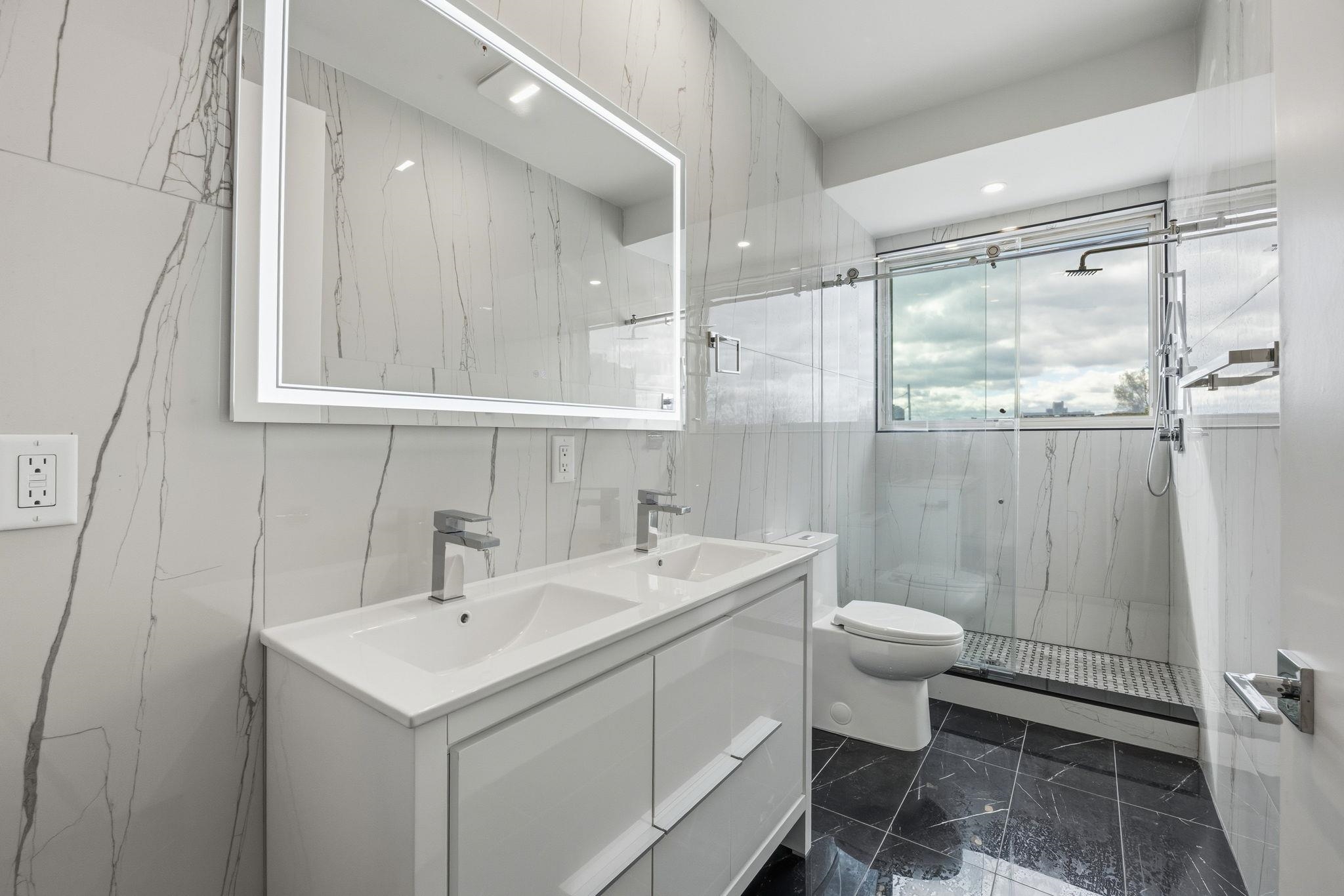 77 Van Reypen Street, Unit 4 Jersey City, NJ 07306 - Photo 6 of 23 a bathroom with a sink toilet and shower