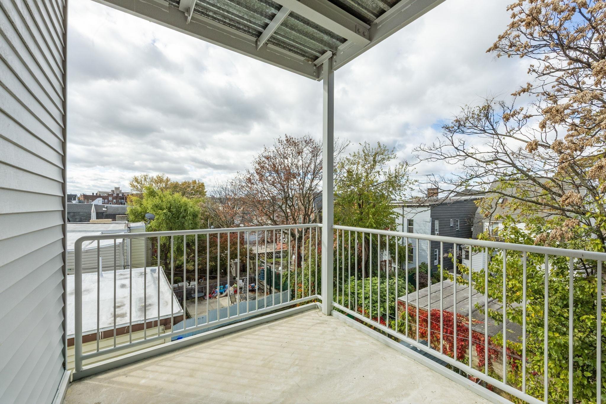 77 Van Reypen Street, Unit 4 Jersey City, NJ 07306 - Photo 8 of 23 a view of a balcony