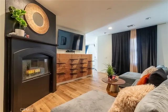 a bedroom with bed and a mirror