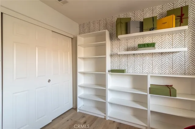 a view of a bedroom with closet