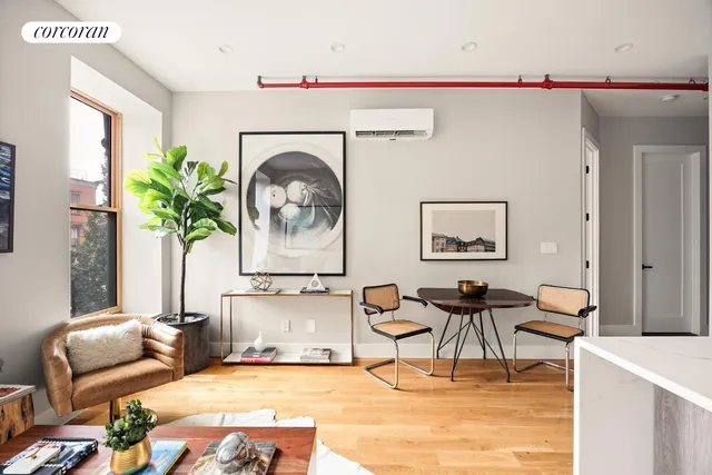 a living room with furniture and a rug