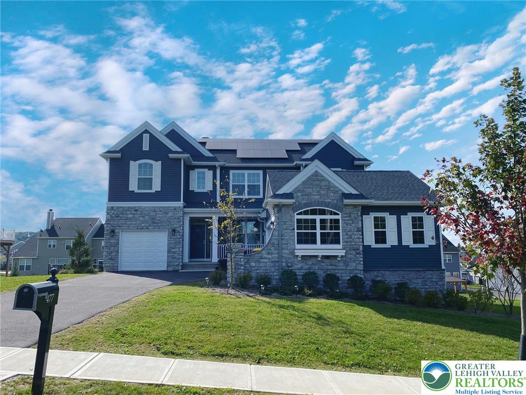 477 Newlins Road East Easton, PA 18040 - Photo 1 of 51 a front view of a house with a garden