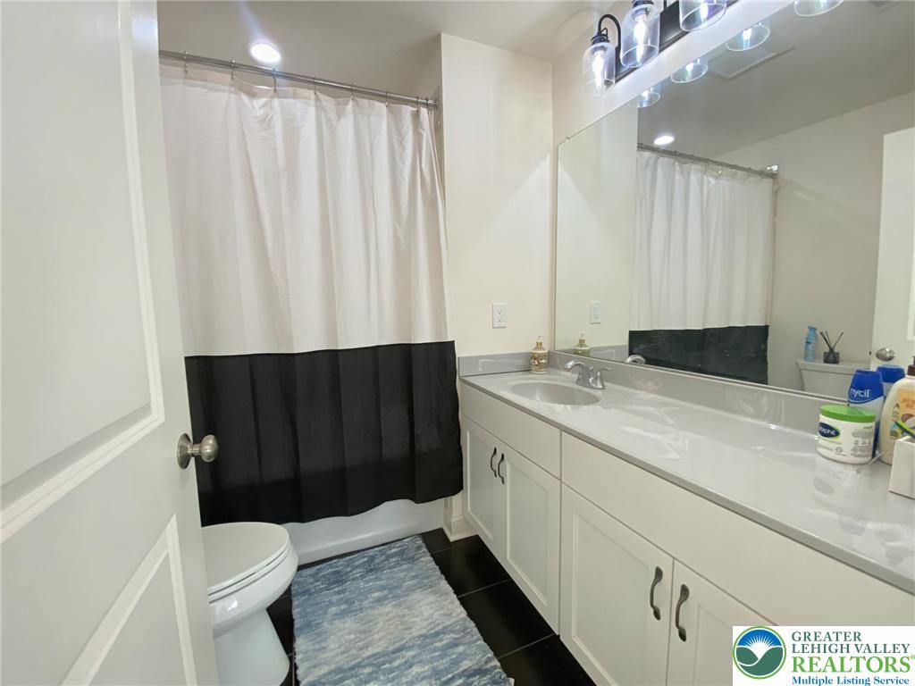 477 Newlins Road East Easton, PA 18040 - Photo 36 of 51 a bathroom with a sink a toilet and shower