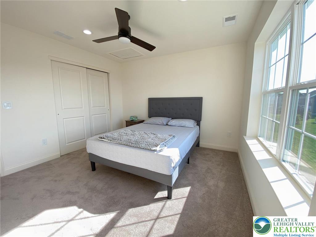 477 Newlins Road East Easton, PA 18040 - Photo 40 of 51 a bedroom with a bed and a large window