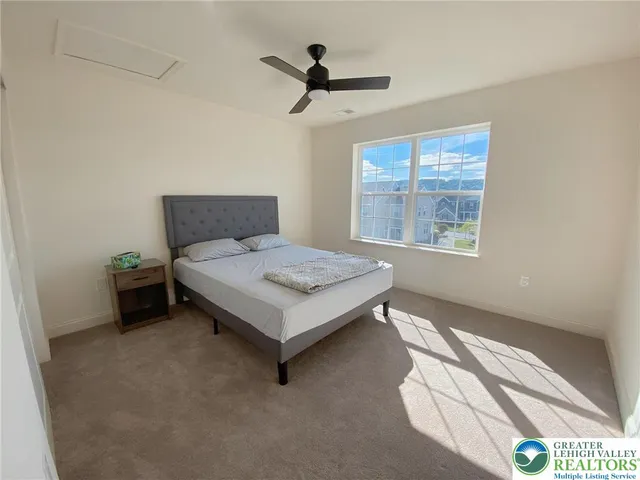 a bedroom with a bed and window