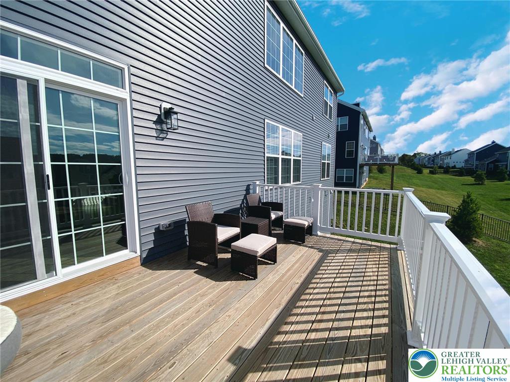 477 Newlins Road East Easton, PA 18040 - Photo 43 of 51 a view of a roof deck with couches and wooden floor