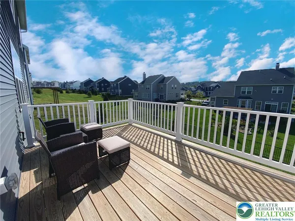 a view of a chairs on the roof deck