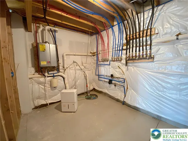 a view of a room with furniture and a chandelier