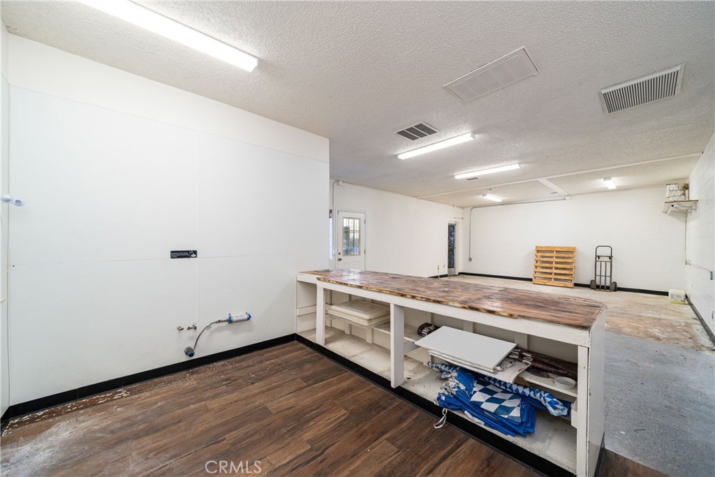 35026 Yucaipa Boulevard, Unit C Yucaipa, CA 92399 - Photo 11 of 14 a kitchen with stainless steel appliances a stove a sink and a refrigerator