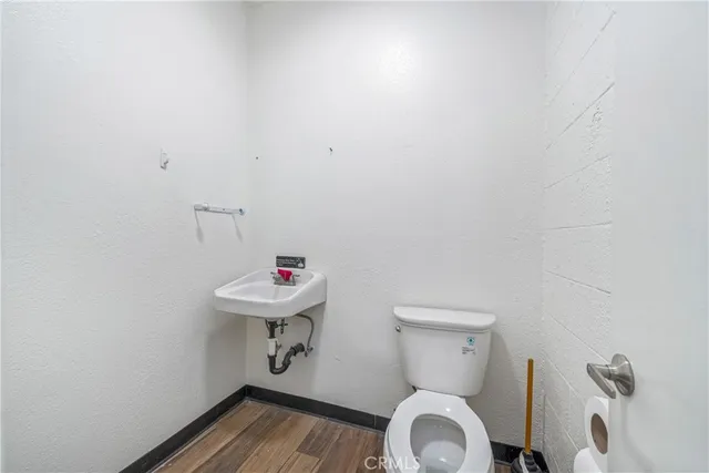 a spacious bathroom with a granite countertop sink and a mirror