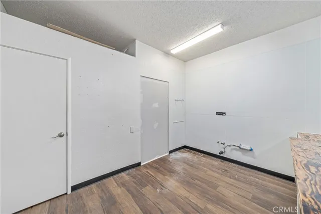 a kitchen with stainless steel appliances a stove a sink and a refrigerator