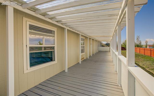 5710 Prospero Road Peyton, CO 80831 - Photo 24 of 34 Another Look At The 60 x 9 Covered Deck
