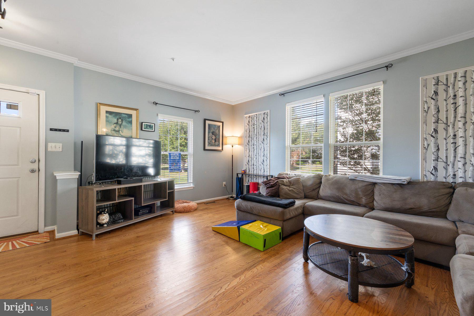 1700 Derrs Square West Frederick, MD 21701 - Photo 2 of 33 Living room w/ high ceilings & crown molding