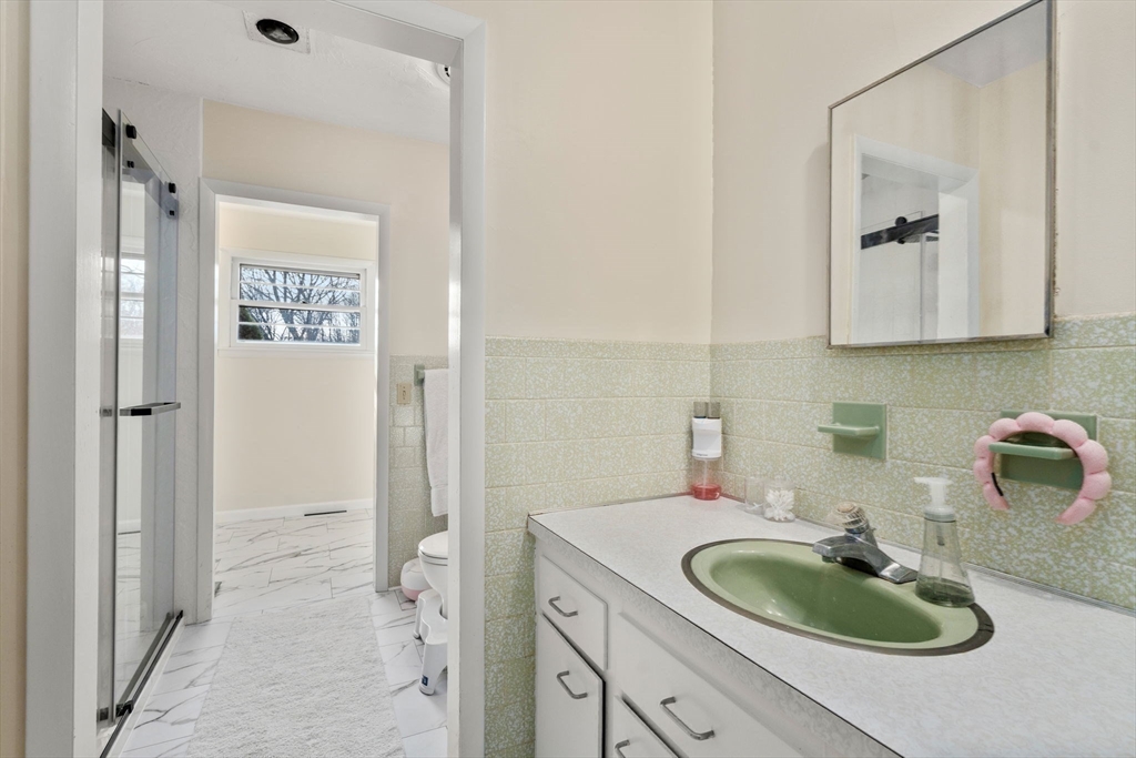 46 Ramshorn Road Dudley, MA 01571 - Photo 19 of 39 a bathroom with a sink and a mirror
