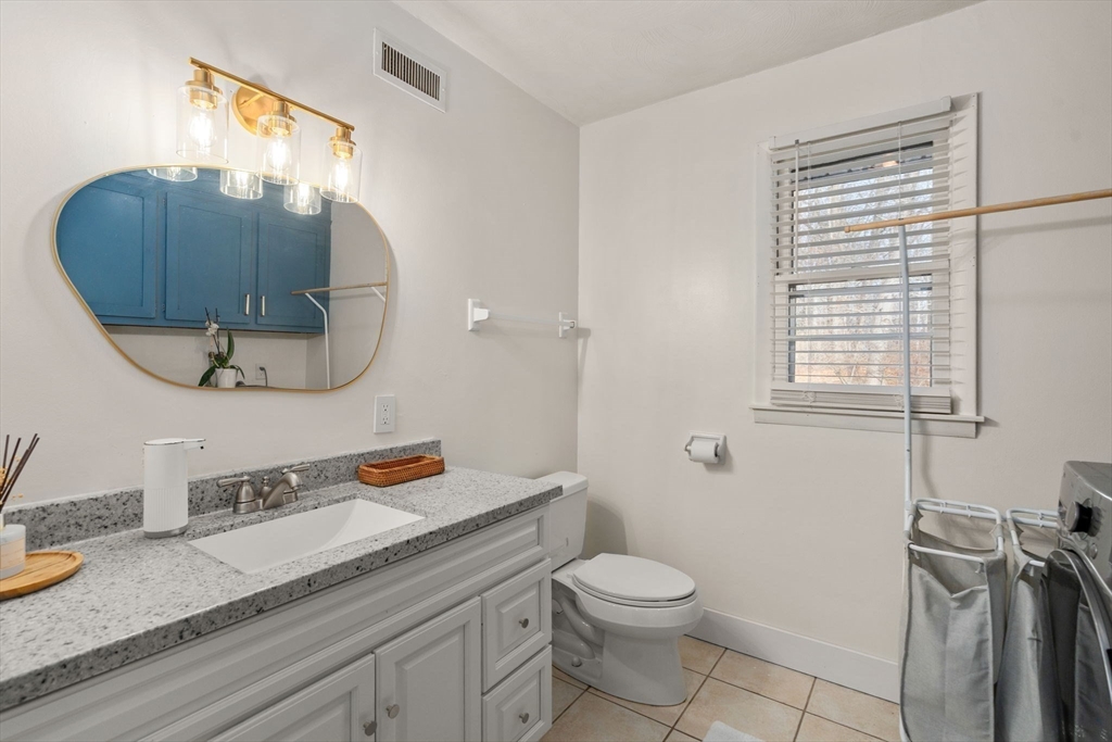 46 Ramshorn Road Dudley, MA 01571 - Photo 21 of 39 a bathroom with a granite countertop sink and a mirror