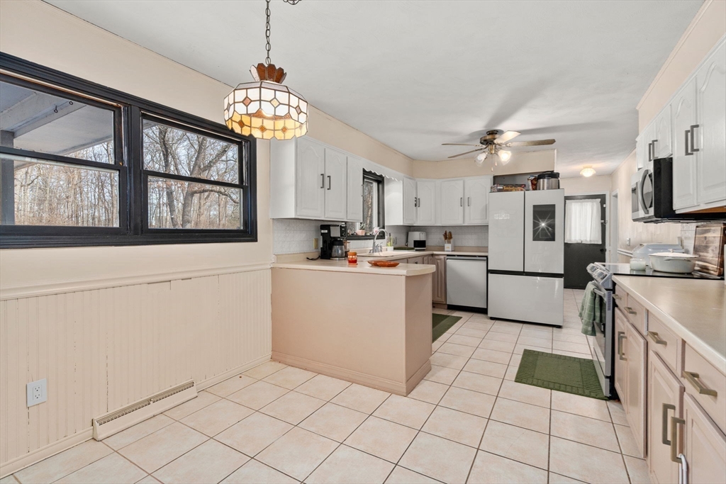 46 Ramshorn Road Dudley, MA 01571 - Photo 22 of 39 a kitchen with a stove a sink dishwasher and a refrigerator