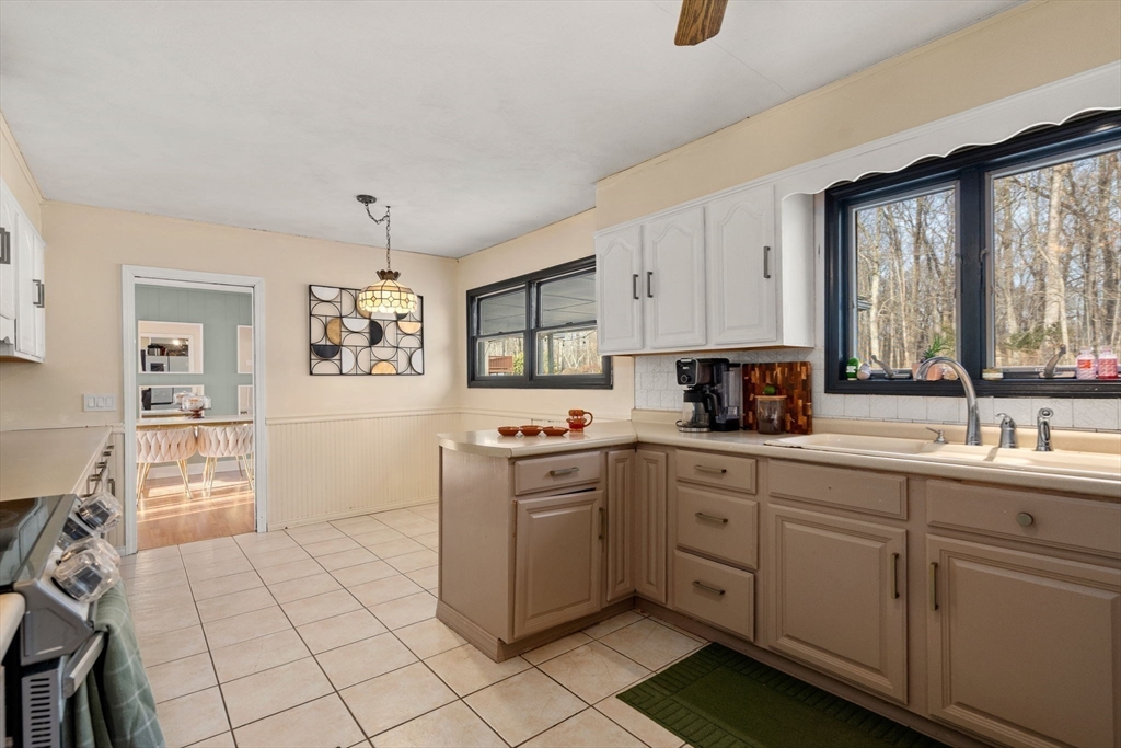 46 Ramshorn Road Dudley, MA 01571 - Photo 27 of 39 a kitchen with a sink cabinets and window