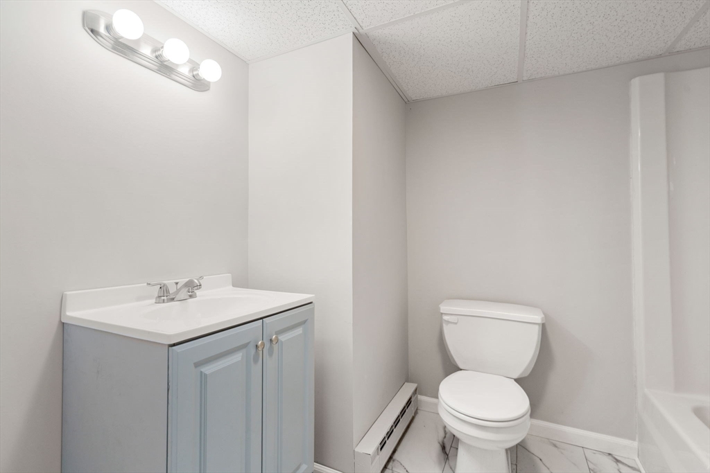 46 Ramshorn Road Dudley, MA 01571 - Photo 28 of 39 a bathroom with a toilet sink and mirror