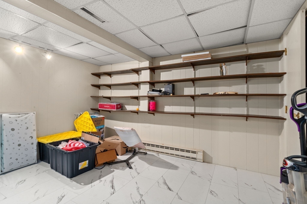 46 Ramshorn Road Dudley, MA 01571 - Photo 31 of 39 a storage room with racks