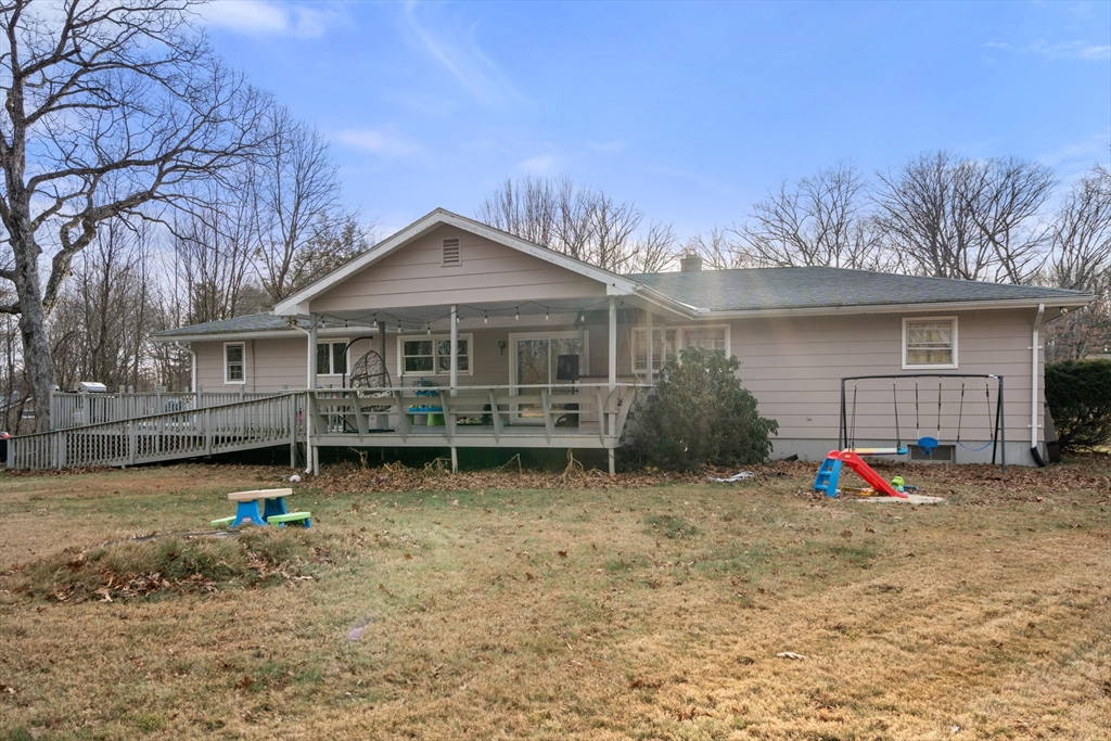 46 Ramshorn Road Dudley, MA 01571 - Photo 36 of 39 a backyard of a house with barbeque oven table and chairs