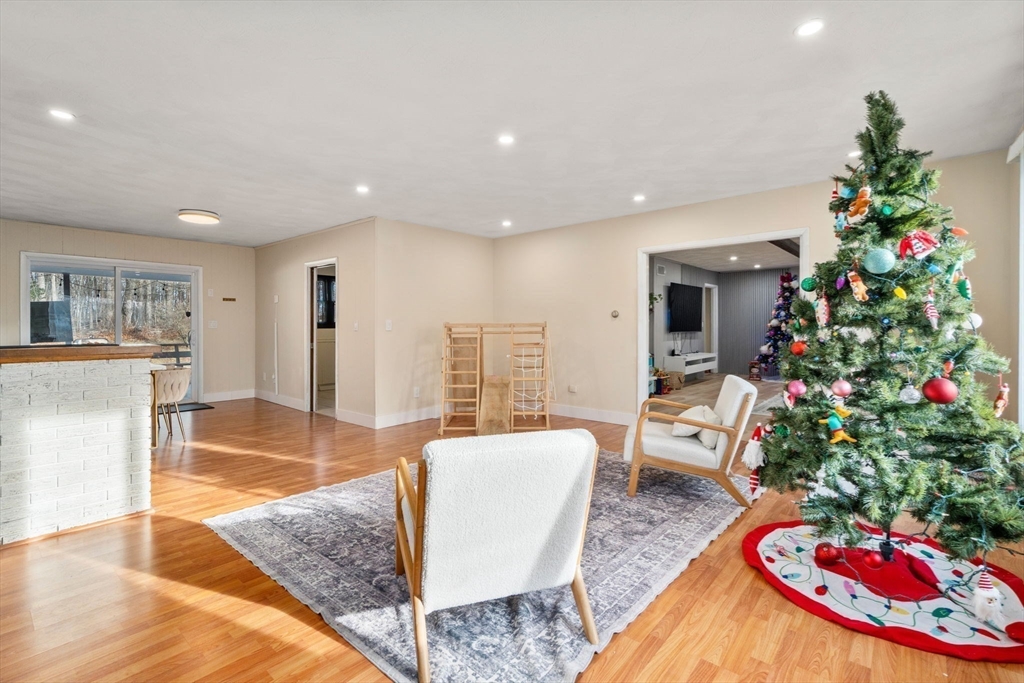 46 Ramshorn Road Dudley, MA 01571 - Photo 6 of 39 a living room with furniture and flowers
