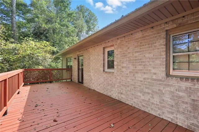 a backyard of a house with wooden floor