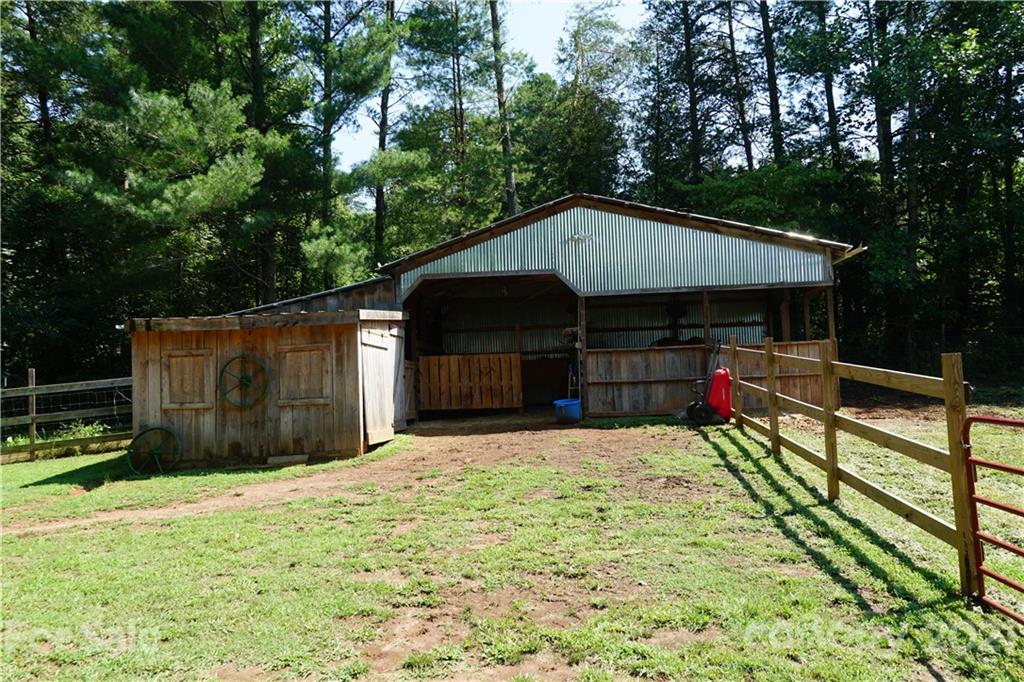 112 John Smith Road Rutherfordton, NC 28139 - Photo 11 of 48 a house with swimming pool in front of it