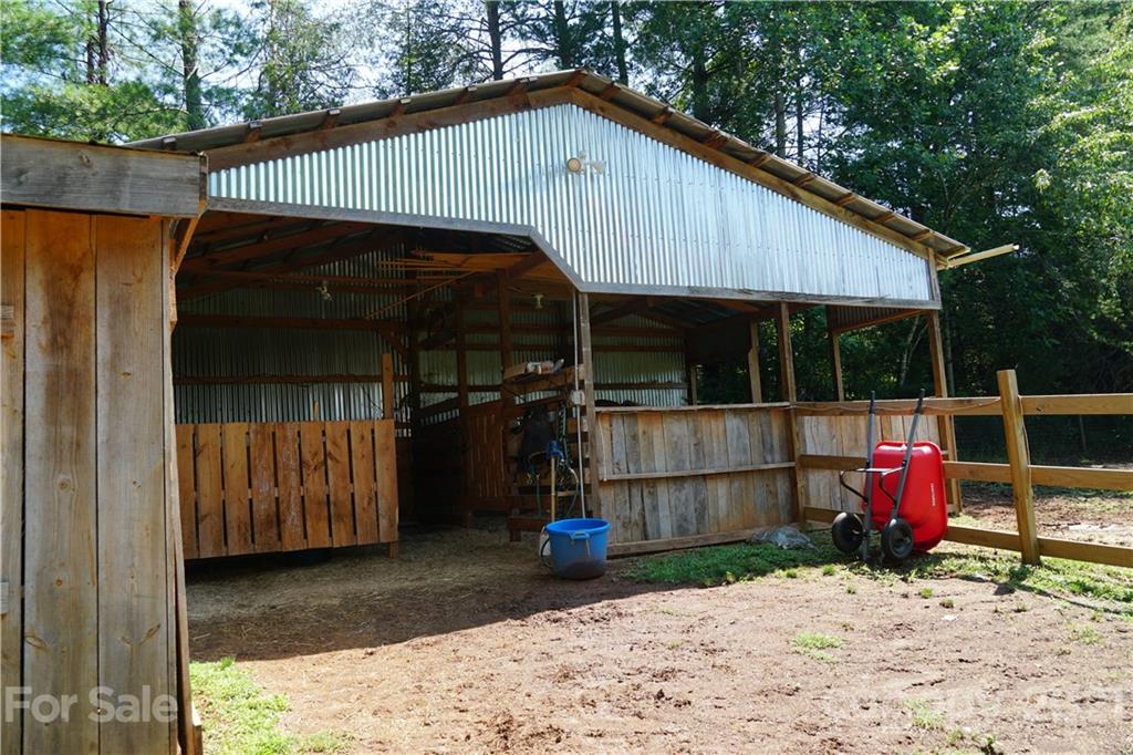 112 John Smith Road Rutherfordton, NC 28139 - Photo 12 of 48 a backyard of a house with barbeque oven table and chairs