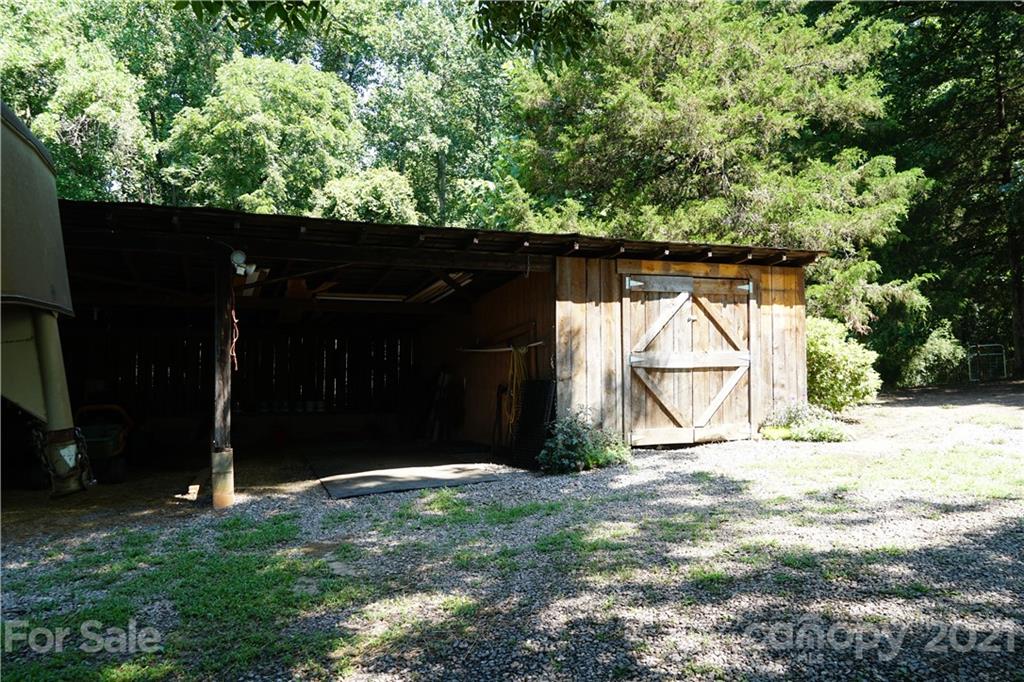 112 John Smith Road Rutherfordton, NC 28139 - Photo 16 of 48 a backyard of a house with lots of green space