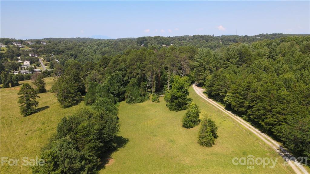 112 John Smith Road Rutherfordton, NC 28139 - Photo 22 of 48 a view of a lake with a mountain in the background