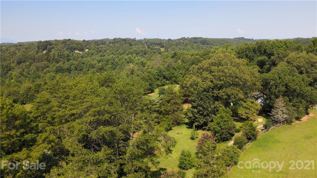 112 John Smith Road Rutherfordton, NC 28139 - Photo 24 of 48 a view of a field with a lush green forest