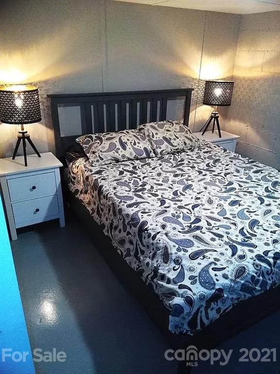 112 John Smith Road Rutherfordton, NC 28139 - Photo 31 of 48 a bed room with a bed and a lamp