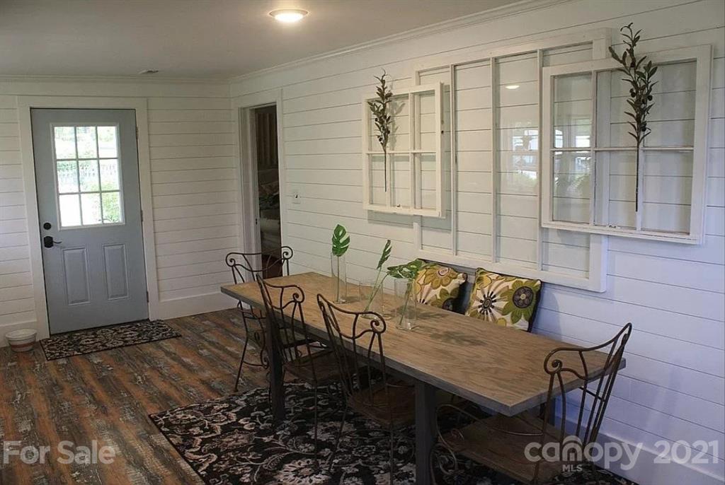 112 John Smith Road Rutherfordton, NC 28139 - Photo 32 of 48 a view of a dining room with furniture and wooden floor