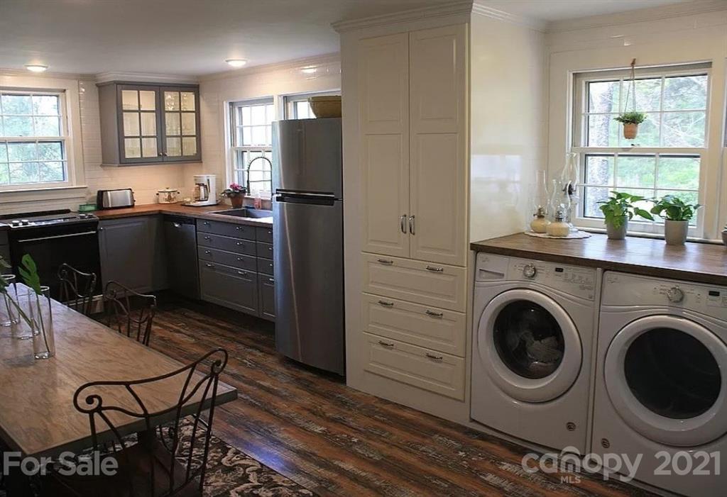 112 John Smith Road Rutherfordton, NC 28139 - Photo 34 of 48 a kitchen with a refrigerator and a stove top oven