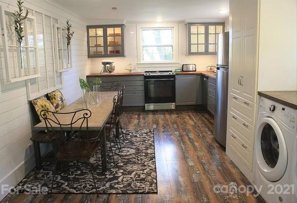 112 John Smith Road Rutherfordton, NC 28139 - Photo 35 of 48 a kitchen with stainless steel appliances granite countertop a stove a sink and a refrigerator