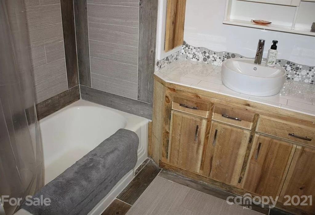 112 John Smith Road Rutherfordton, NC 28139 - Photo 38 of 48 a bathroom with a sink and a mirror