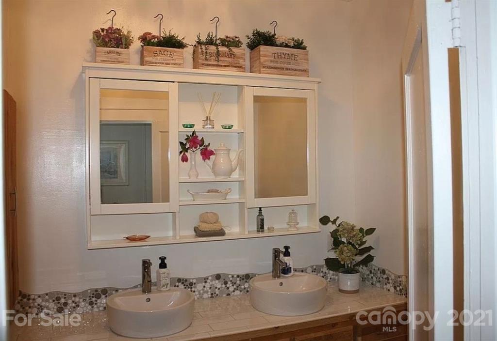 112 John Smith Road Rutherfordton, NC 28139 - Photo 39 of 48 a bathroom with a sink and a mirror