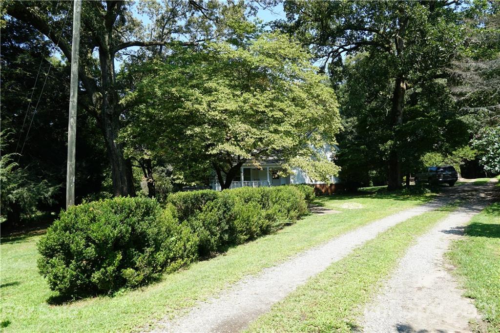 112 John Smith Road Rutherfordton, NC 28139 - Photo 5 of 48 a view of a backyard with large trees