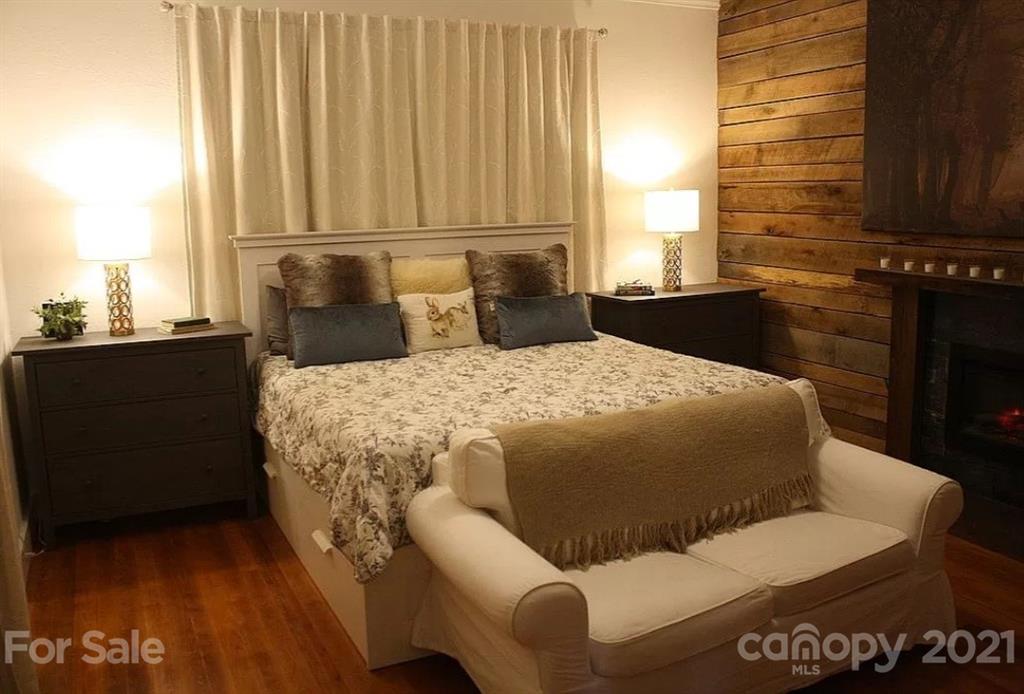 112 John Smith Road Rutherfordton, NC 28139 - Photo 41 of 48 a bedroom with a bed and wooden floor