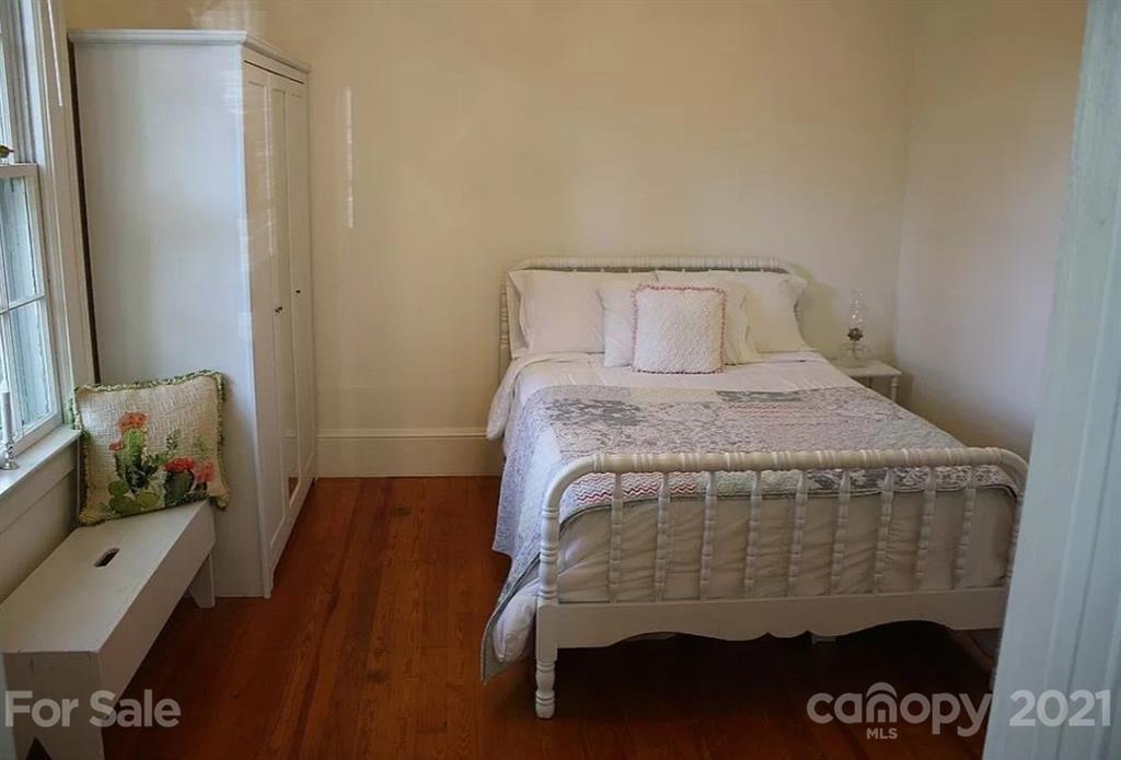 112 John Smith Road Rutherfordton, NC 28139 - Photo 46 of 48 a bedroom with a bed and wooden floor