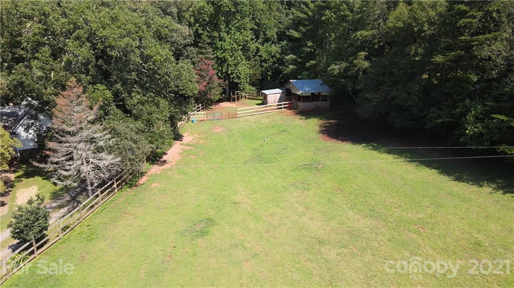 112 John Smith Road Rutherfordton, NC 28139 - Photo 9 of 48 a backyard of a house with yard and outdoor seating